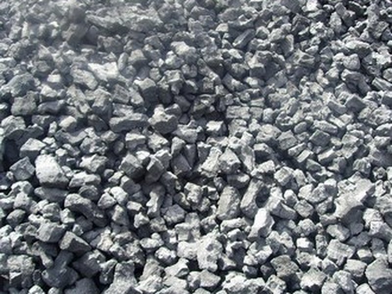Coke granules in a fuel handling stockpile